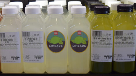 Whole Foods Market Juices with complex and simple labels alternatively facing forward.