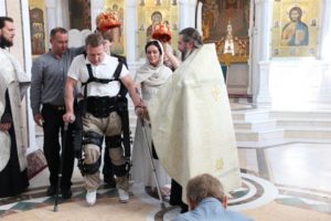 ExoAtlet pilot Sergei Rubinshtein walks with his wife Galina at their church wedding in Arkhangelsk. Photo: Corporation for the Development of the Arkhangelsk Region press service.